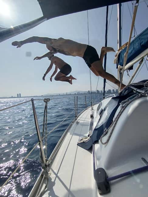 Barcelona Badalona : Sailboat Tour, Snacks, Drinks, Swimming - Barcelona skyline from the sea: use the binoculars, don’t just look