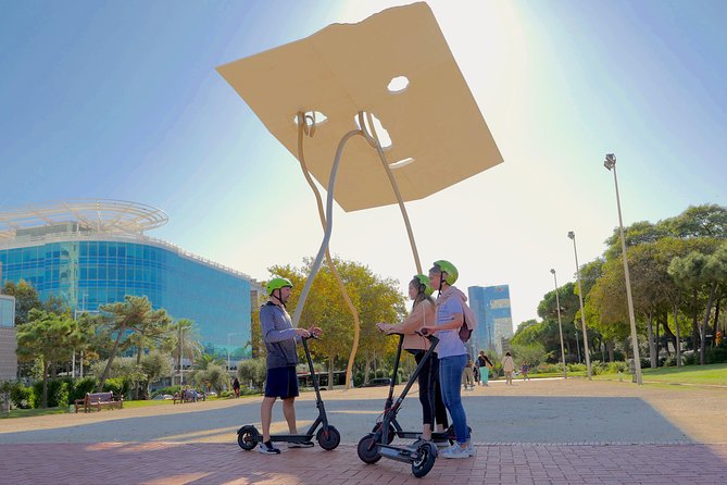 Barcelona Electric Scooter Tour - Columbus Monument, then the port-city story keeps going