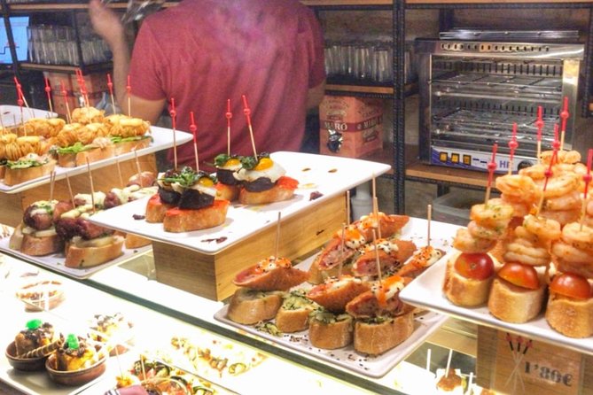 Barcelona Food Tour: Market & Gothic Quarter with Expert Guide - Las Ramblas to La Boqueria: starting with Catalan food basics