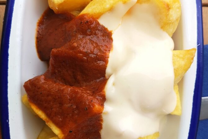Barcelona Food Tour: Tapas, Drinks and Delights with a Local - Stop 2: Carrer de la Mercè for anchovies, wine, and pan con tomate