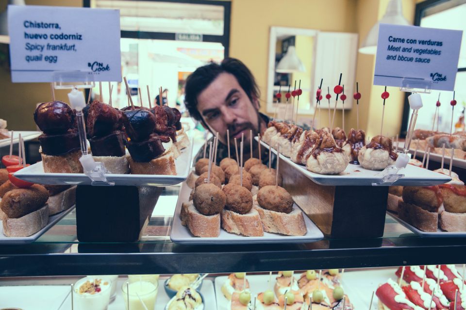 Barcelona: Foodie Walking Tour with Sagrada Familia Tickets - Getting to Sagrada Familia by taxi and using skip-the-line entry