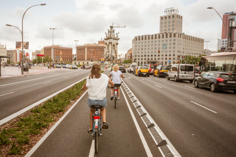 Barcelona Montjuic Three-Hour Bike Tour - Up Avinguda de la Reina Maria Cristina: architecture in motion