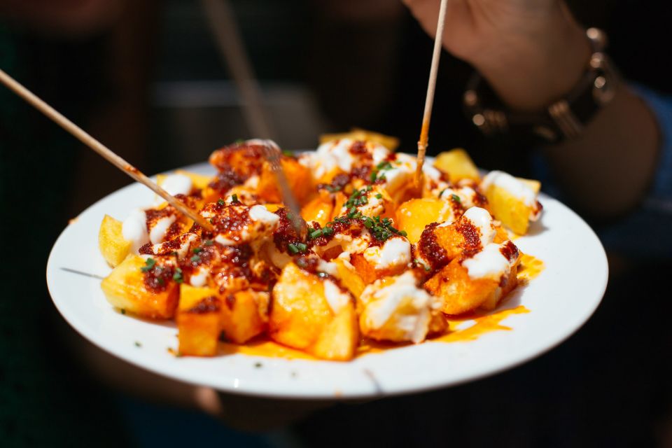 Barcelona: Private Food Tour – 10 Tastings with Locals - Landmark Stops: Hospital de Santa Creu, Comte Borrell, and Santa María del Pi