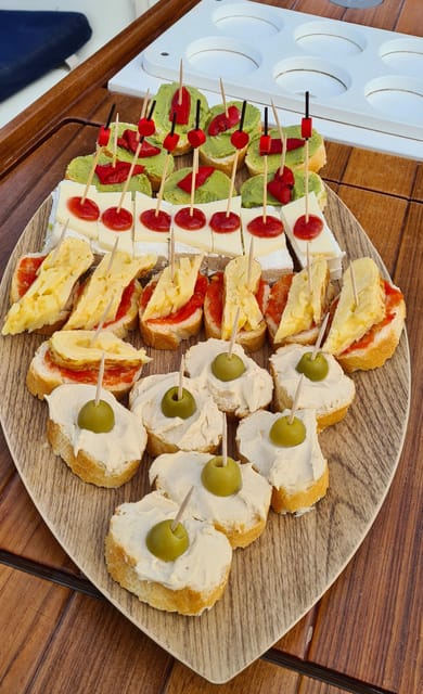 Barcelona: Sailing Tour with Spanish Tapas and Drinks - What’s included during the 2-hour coastal sail