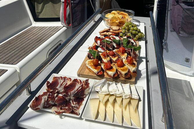 Barcelona: Sailing Tour with Tapas, Drinks, Swim & Sunset Option - Sunset option: how the light changes the whole trip