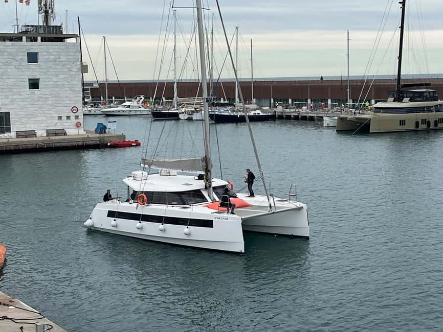 Barcelona: Shared cruise on luxury catamaran Drinks + Snacks - Boarding the Turtur Experience Catamaran at Mooring 1540