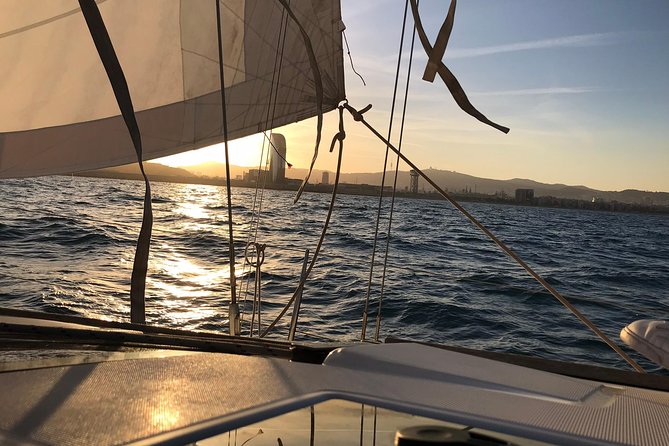 Barcelona Sunset Private Sailing with Light Snacks and Open Bar - The open-sea sunset moment: skyline, mountains, and the best seat in Barcelona