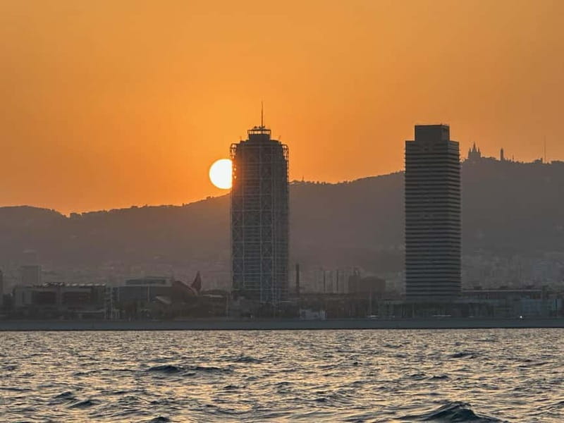 Barcelona: Sunset Sailboat Cruise with Open Bar and Snacks - Barceloneta Beach hour: your real sunset window