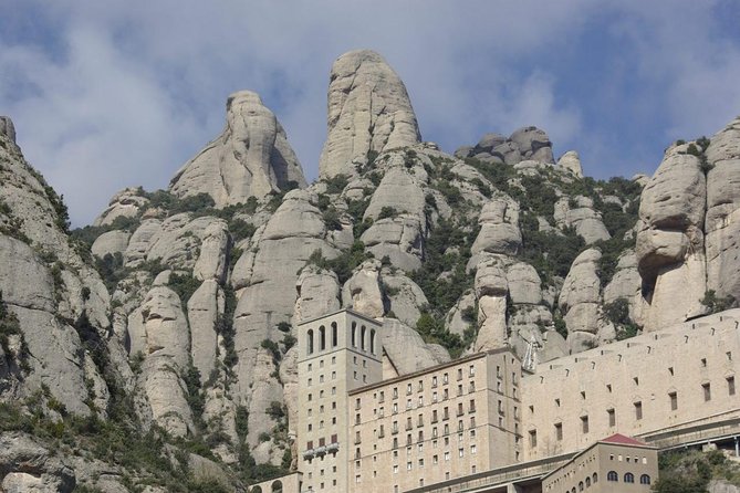 Easy Montserrat: Half Day Trip from Barcelona - Abadia de Montserrat: What the Guided Admission Actually Helps You Notice