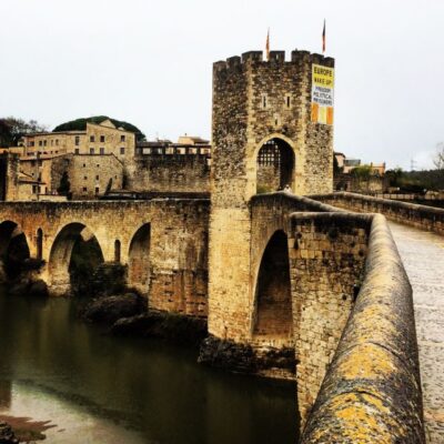 From Barcelona: Medieval Villages and Volcanic Hiking Tour - Castellfollit de la Roca: the cliffside medieval village above two rivers