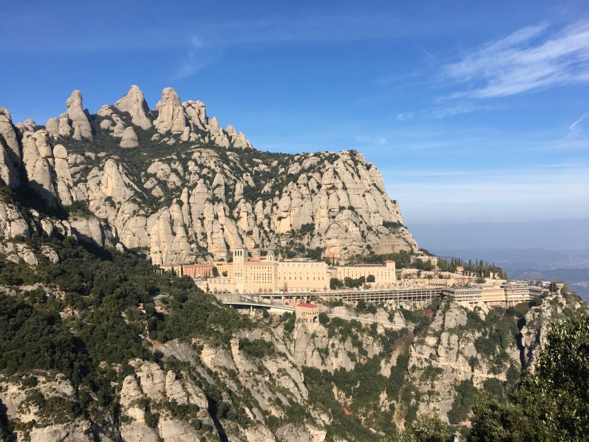 From Barcelona: Montserrat Mountain Hike and Abbey Tour - Hiking Montserrat: trails, hermitages, and a guided focus on footing