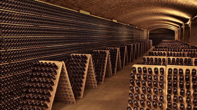 Montserrat Private Day Trip with Codorniu Cava Cellar Tasting - Mercat de Montserrat: cheese, hams, and meeting the people behind the products