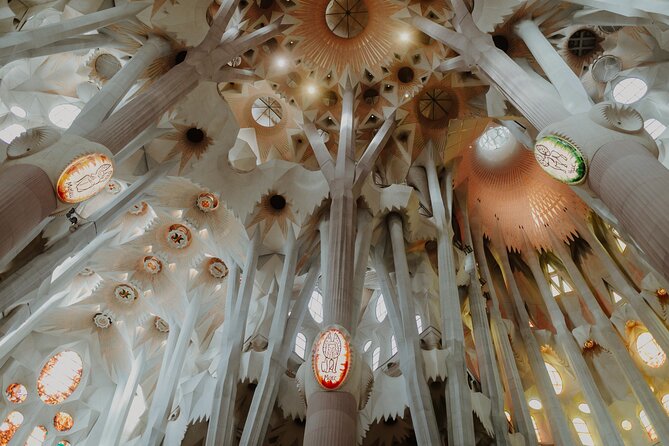 Sagrada Familia Guided Tour with Skip the Line Ticket - Inside the basilica: light, stained glass, and the 18 spires effect
