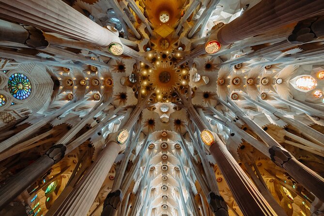 Skip the Line Sagrada Familia Guided Tour & Optional Cava Upgrade - Inside Sagrada: tree-column canopy, stained glass, and the light effect
